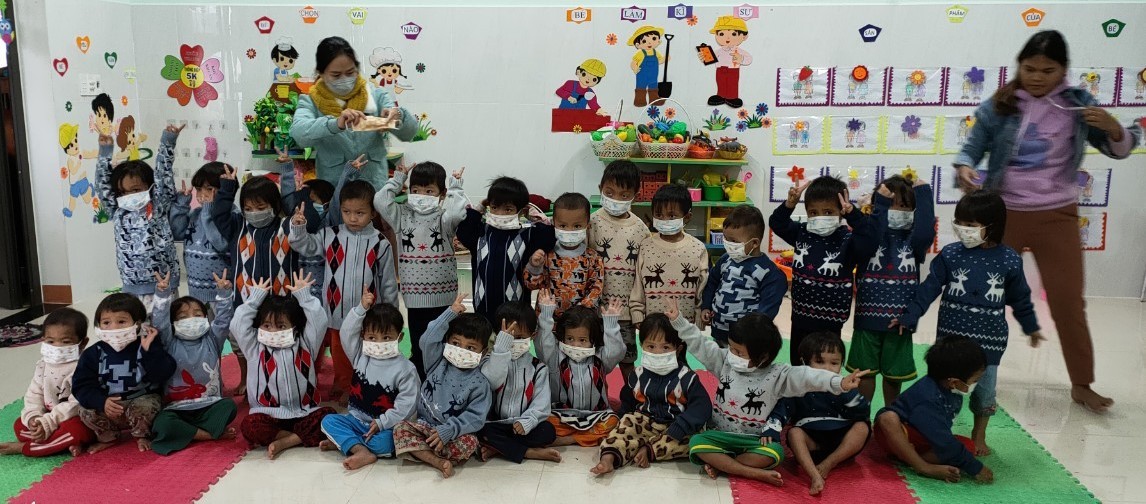 Description: A group of children posing for a photo

Description automatically generated with medium confidence